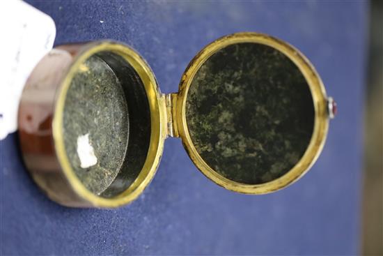 A 19th century continental silver gilt and multi hardstone segmented circular snuff box and cover, 7cm.